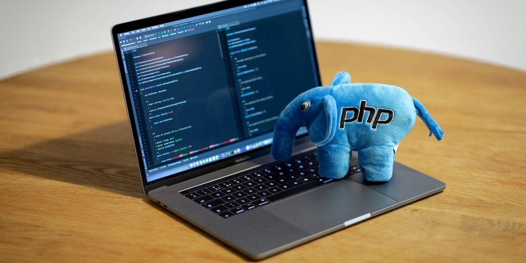 blue elephant figurine on macbook pro